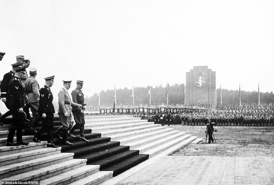 Adolf Hitler arrives to dedicate the foundation stone of the new German Stadium in Nuremberg